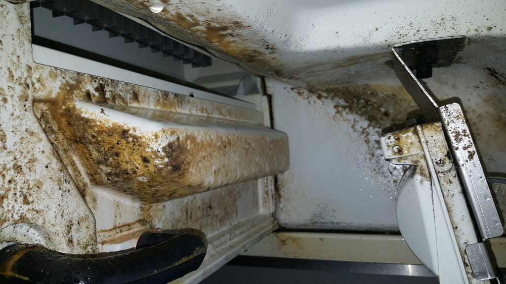 Un-maintained ice machine showing built-up grime